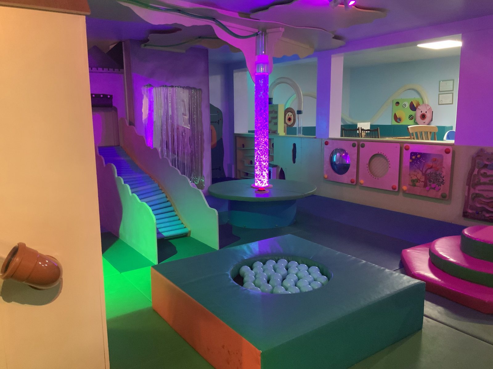 Indoor play area with slide, ball pool and padded steps